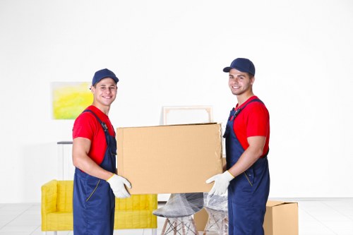 Careful loading of sofas and household furniture into a removals vehicle