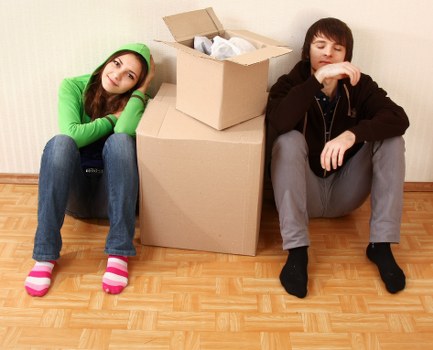 Boxes and small furniture arranged for a student move