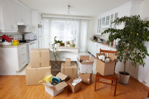 Removal van and moving boxes prepared for a flat move in Kennington