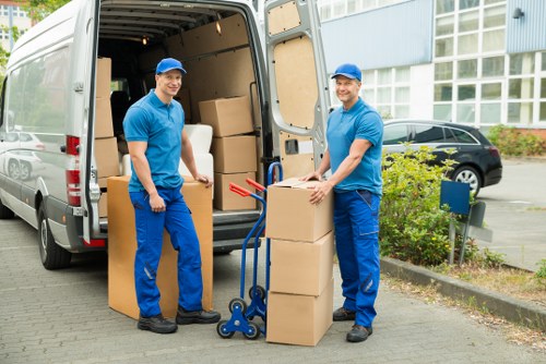 Moving team handling boxes and furniture for a Kennington property